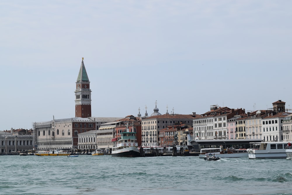 a large body of water with a clock tower in the background