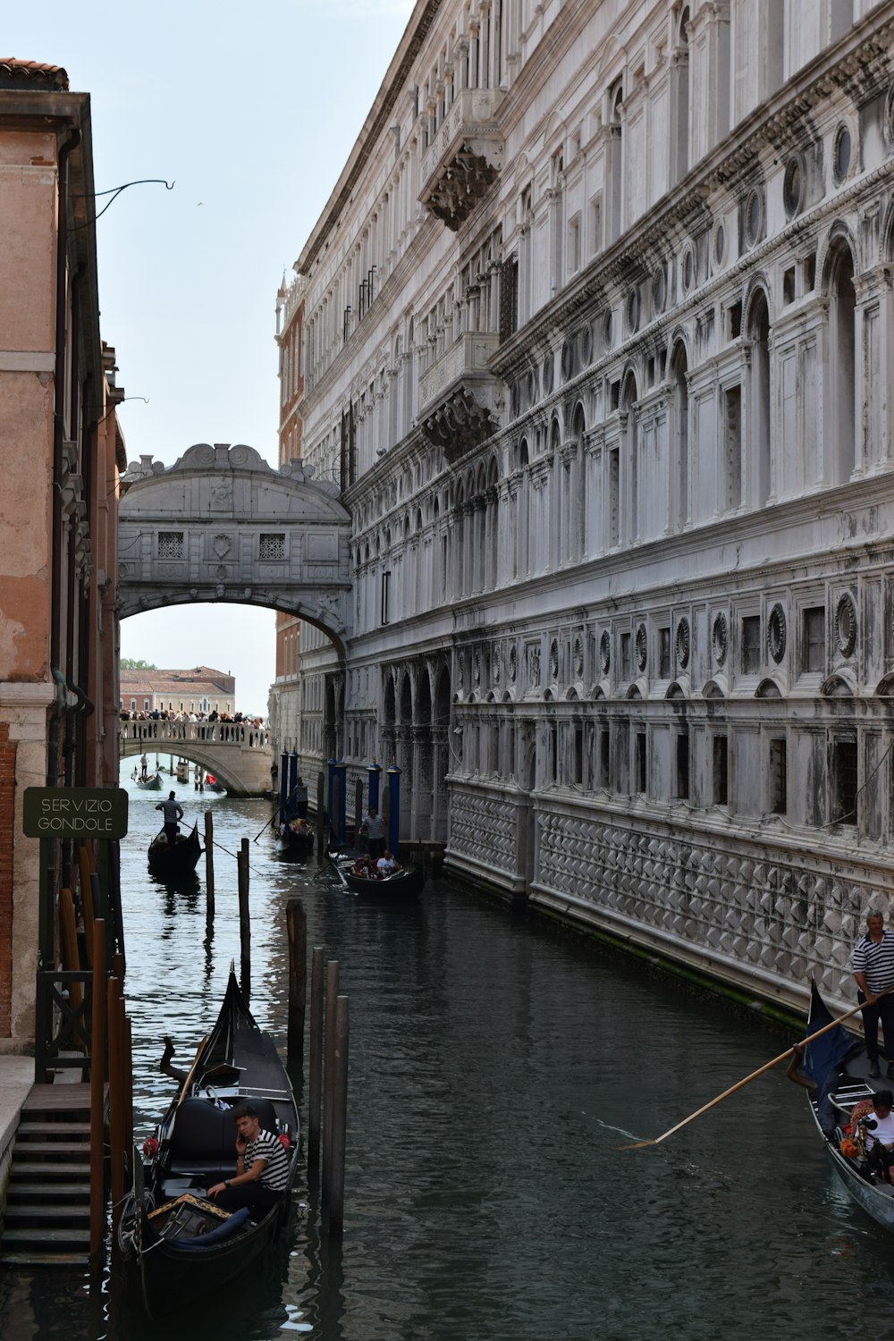 a couple of gondolas that are sitting in the water