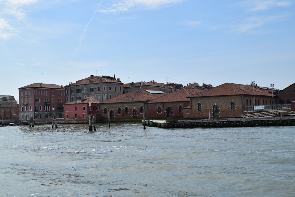 a body of water with buildings in the background