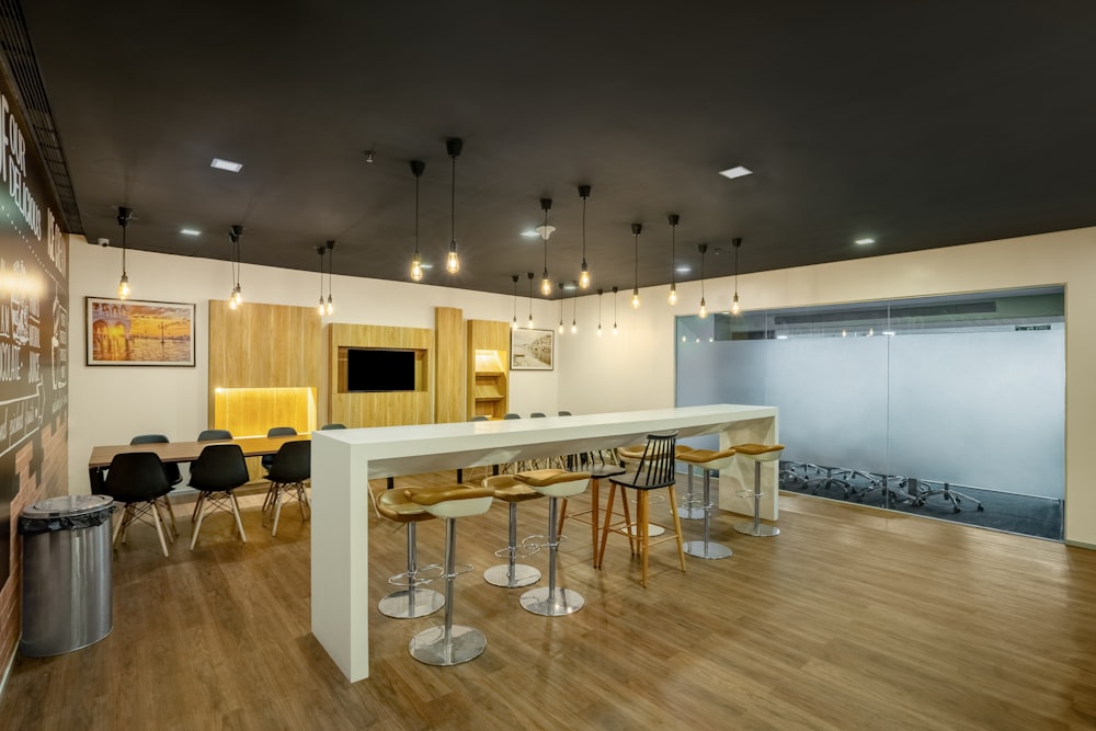 a room with a long table and chairs