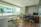 A sleek, minimalist office interior with monochrome color tones and natural light.