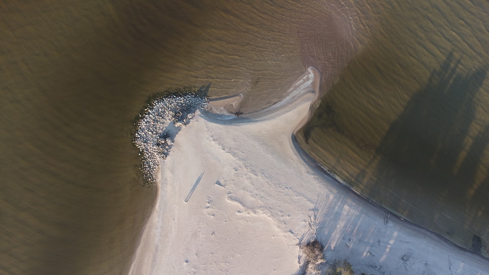 an aerial view of a beach and a body of water