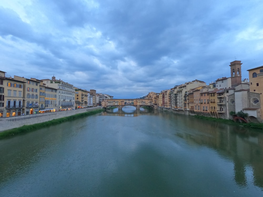 a river running through a city next to tall buildings