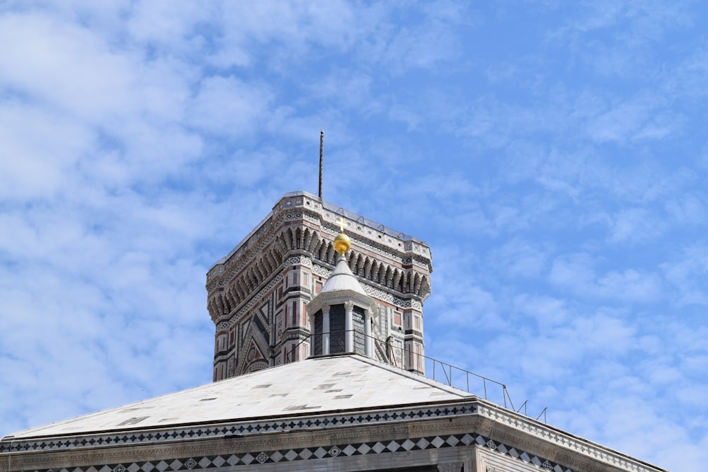 a tall building with a clock on the top of it