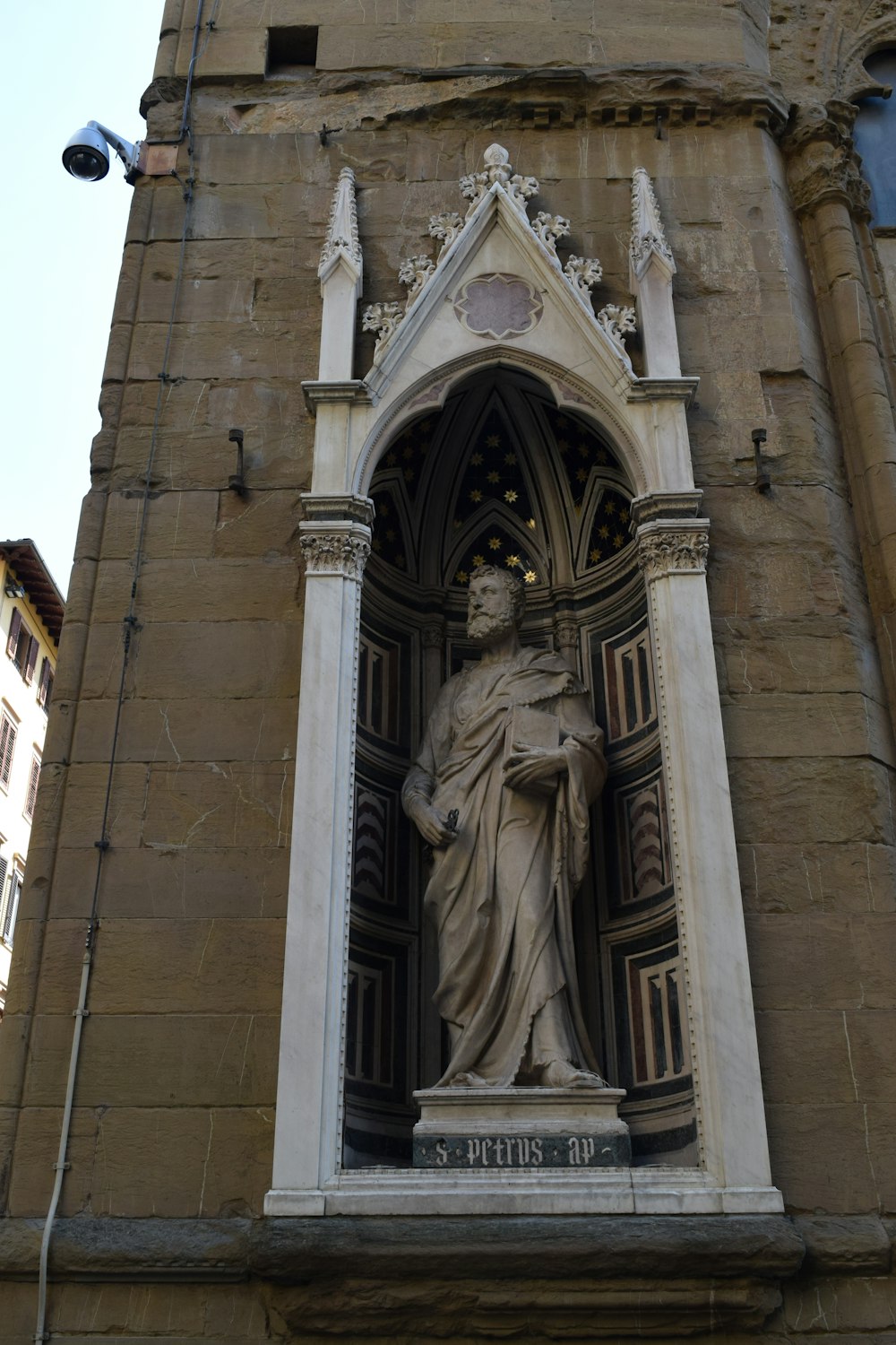 a statue of a woman in a doorway of a building