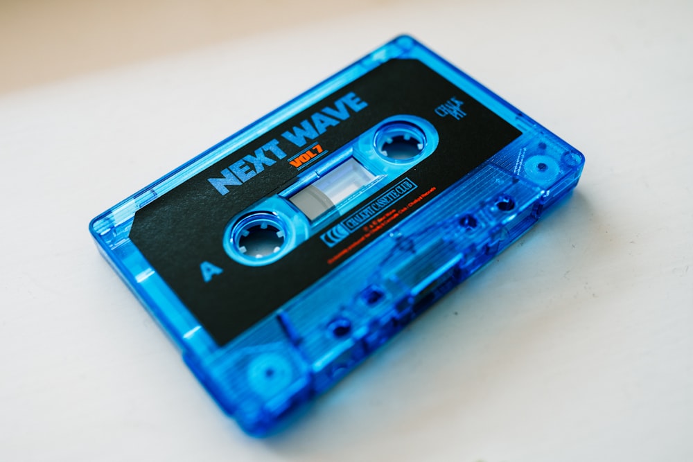 a blue tape recorder sitting on top of a table