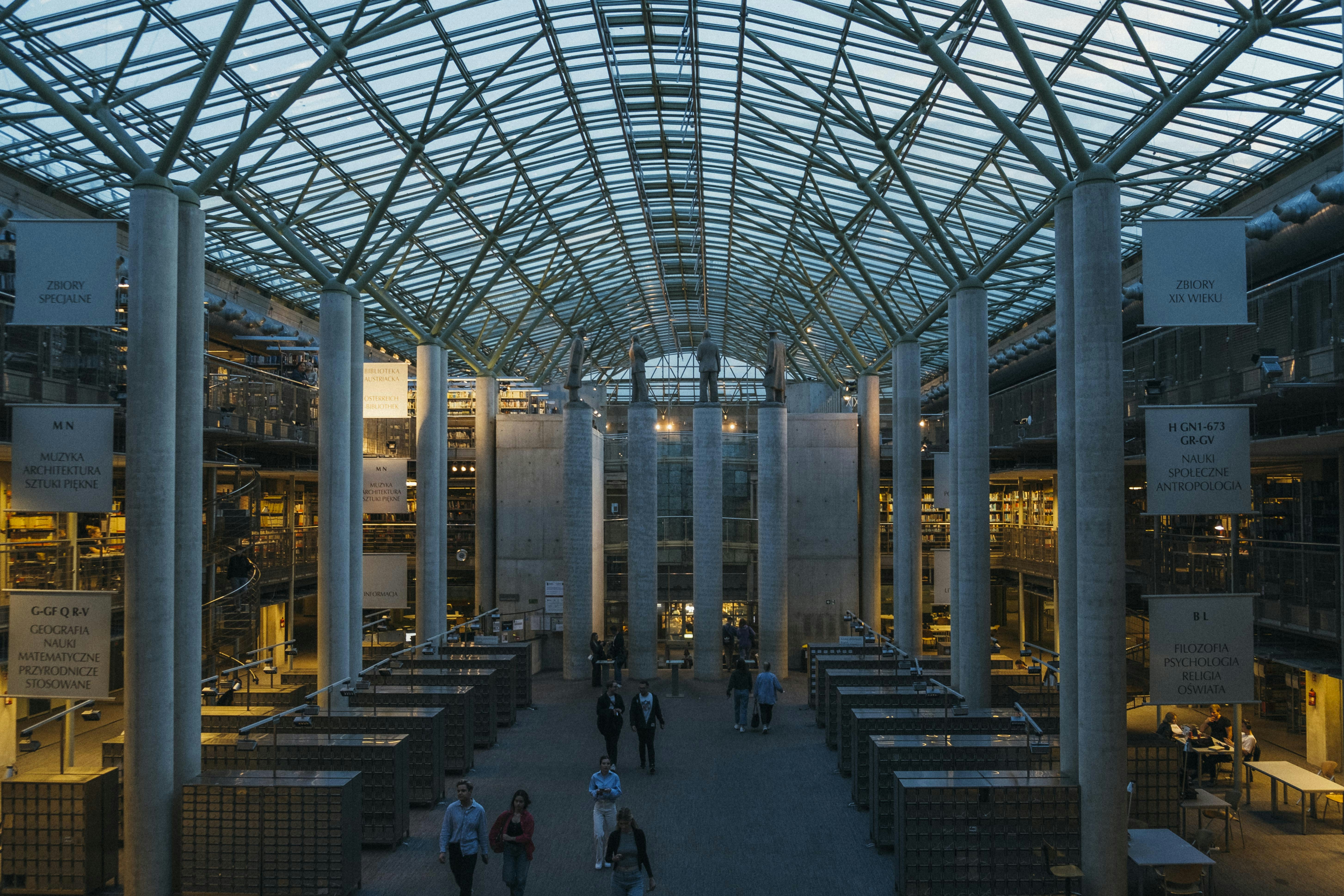 a group of people walking inside of a building