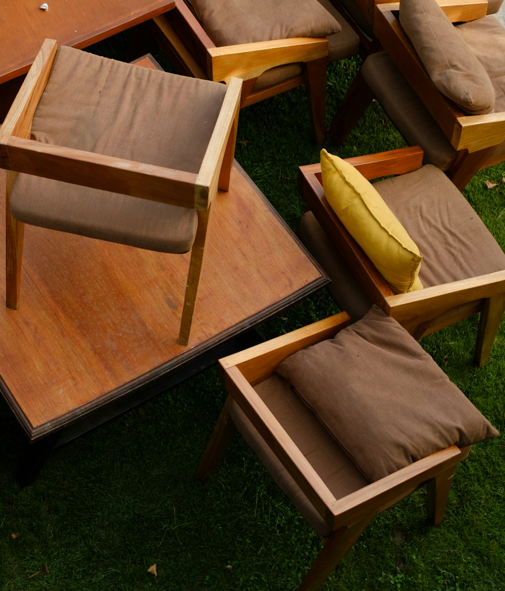 a bunch of chairs and tables on some grass