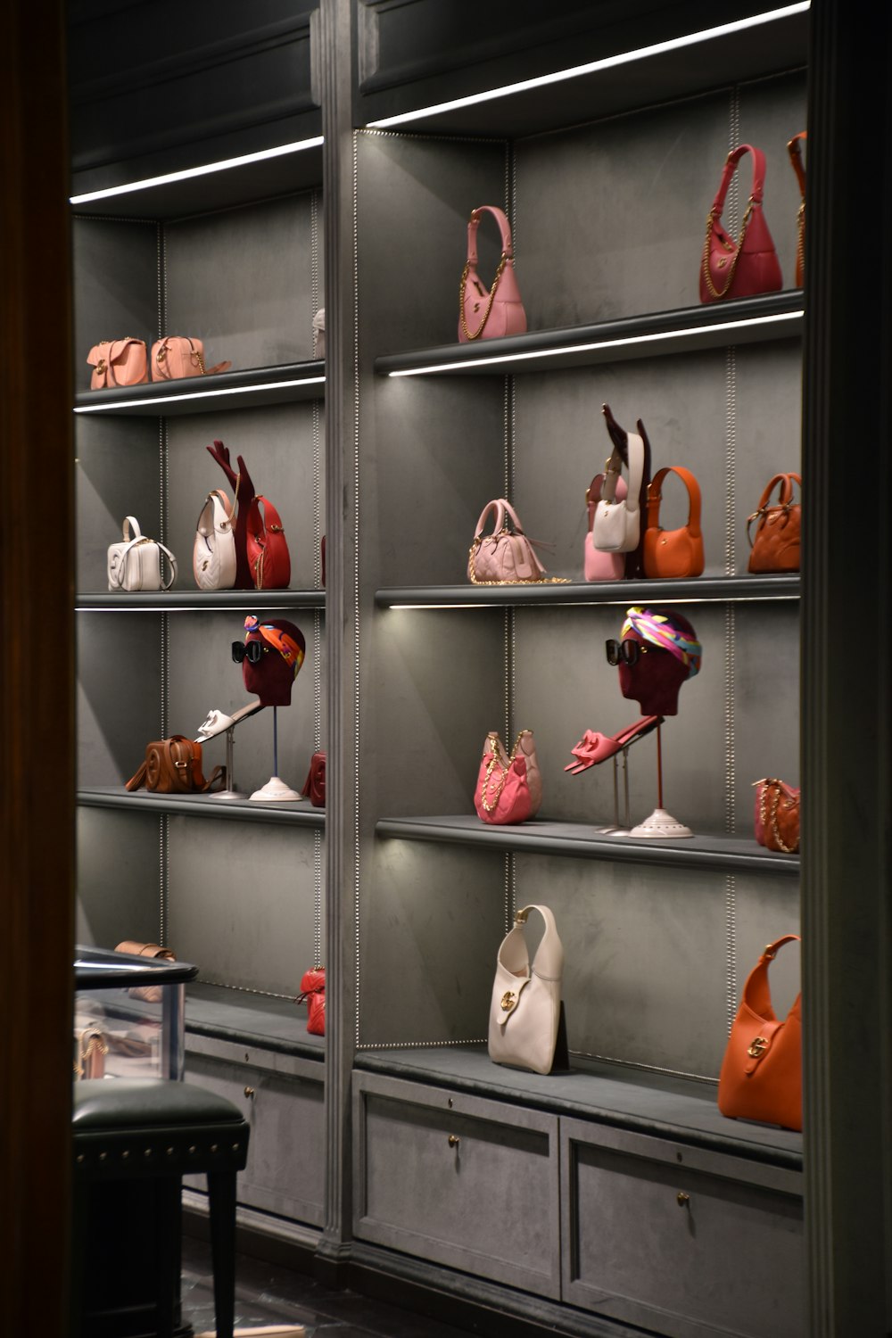 a display case filled with lots of purses
