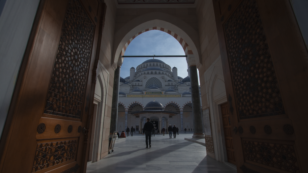 a person standing in a doorway of a building