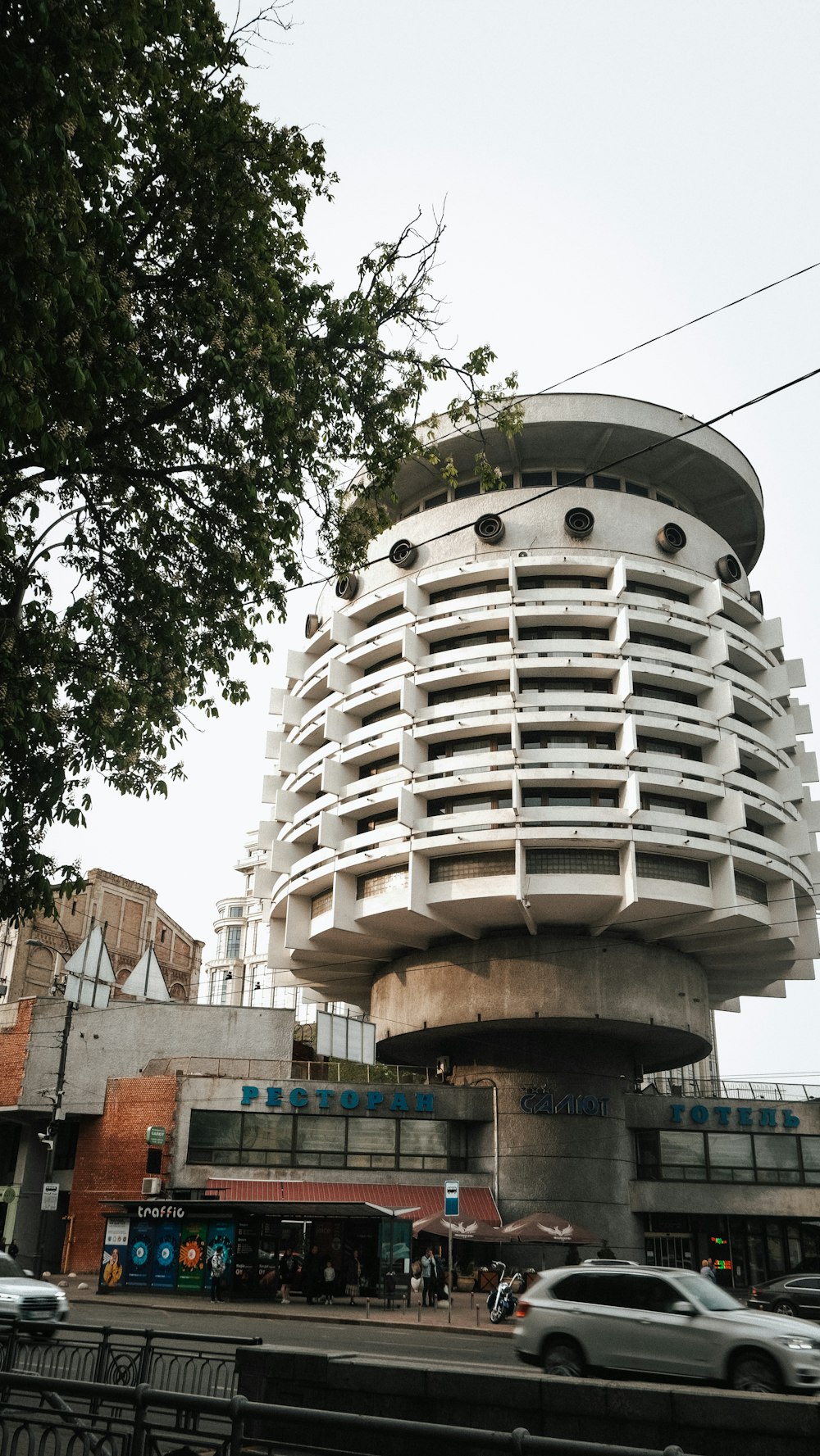 a tall building with a circular design on top of it