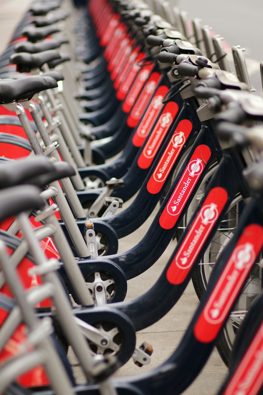 a row of red and black bicycles parked next to each other