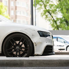 a white car parked on the side of the road