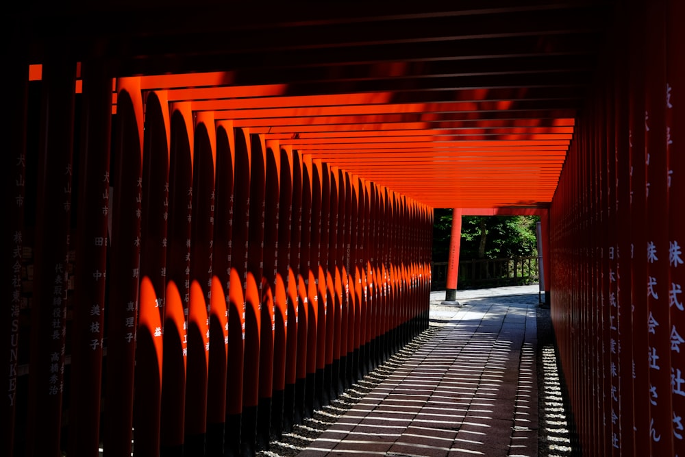 a walkway lined with lots of orange poles