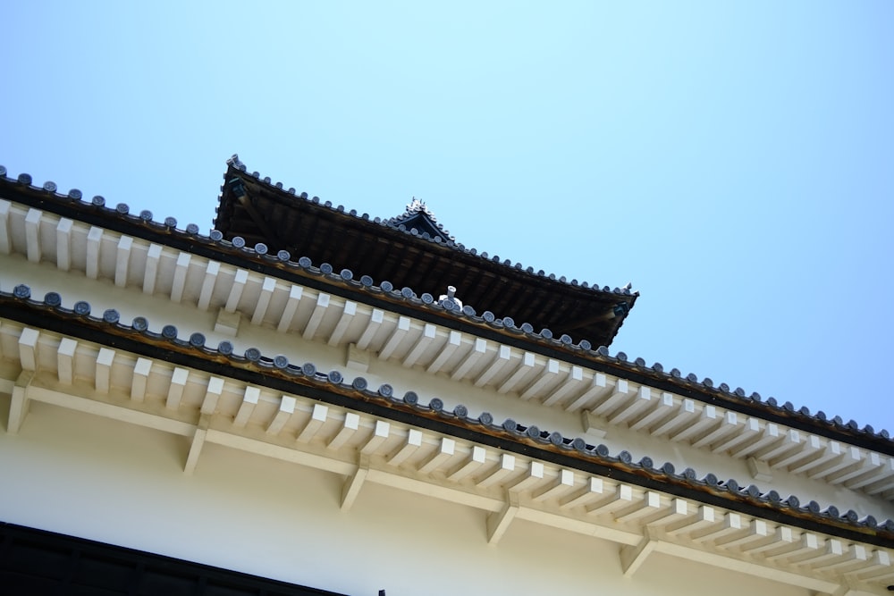 the roof of a building with a blue sky in the background