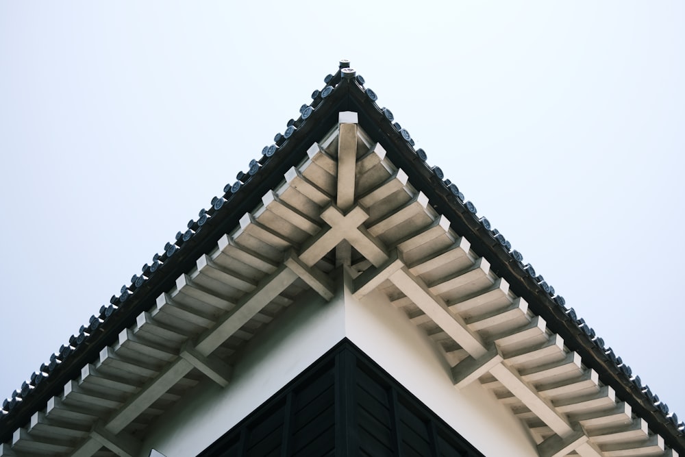 a close up of a roof with a sky background