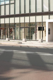 Commercial building exterior showing glass windows and entrance.