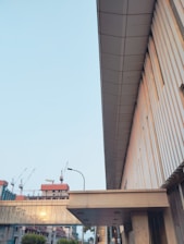 Architectural blueprint overlay on a modern housing development site at dawn.