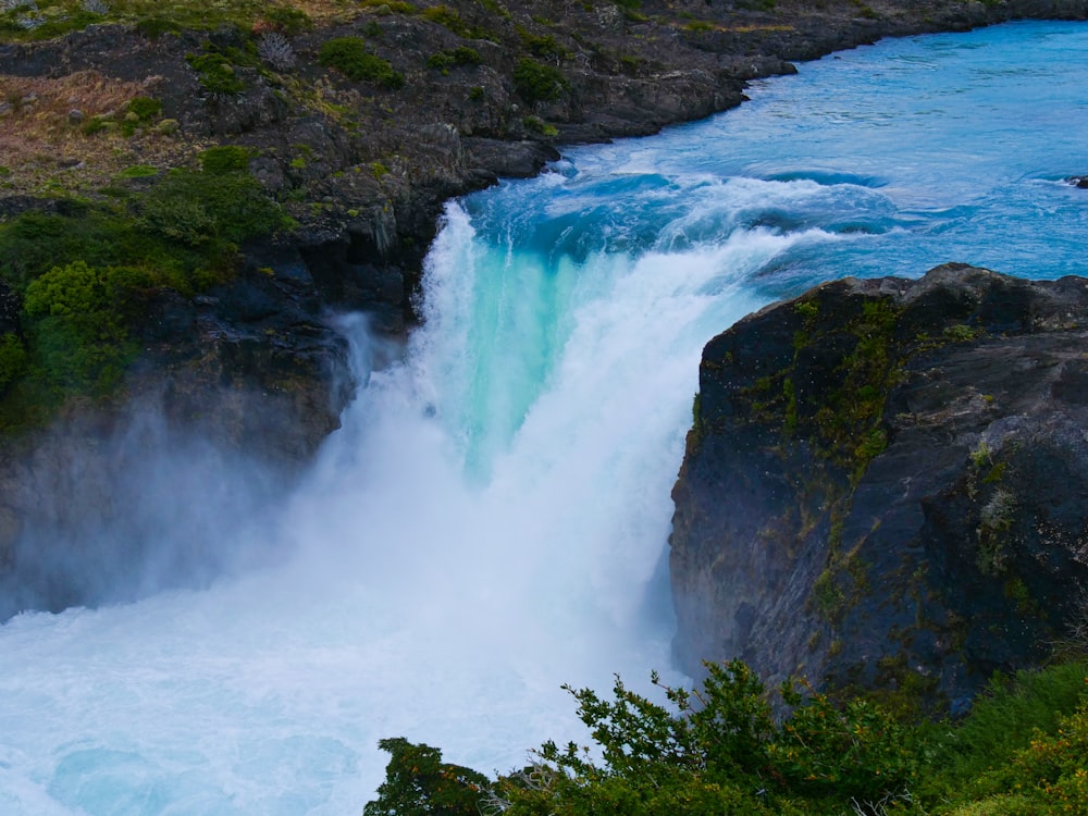 a large waterfall with water coming out of it