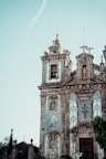 an old church with a cross on the top of it