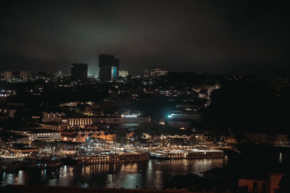 a night view of a city and a harbor