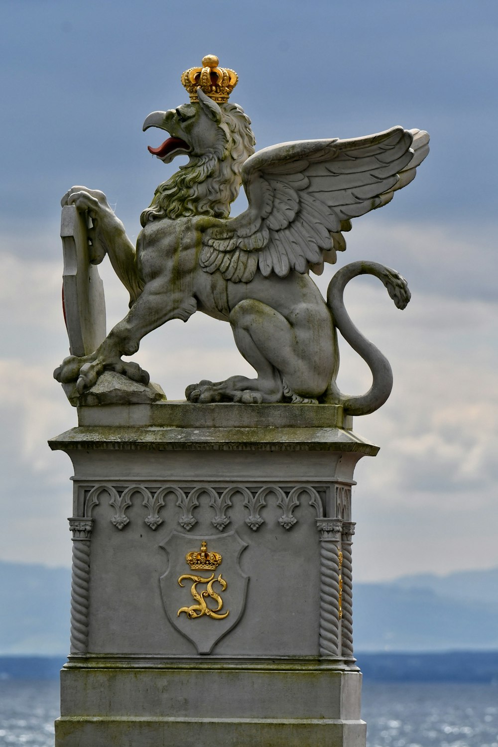 a statue of a lion with a crown on its head