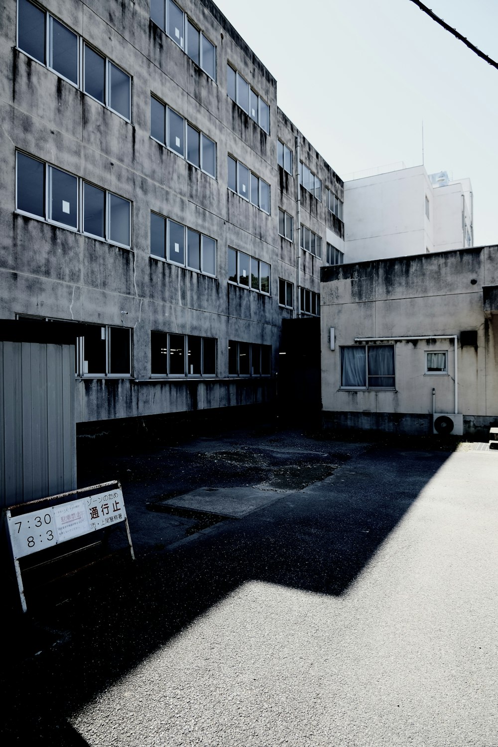 an empty parking lot in front of a building