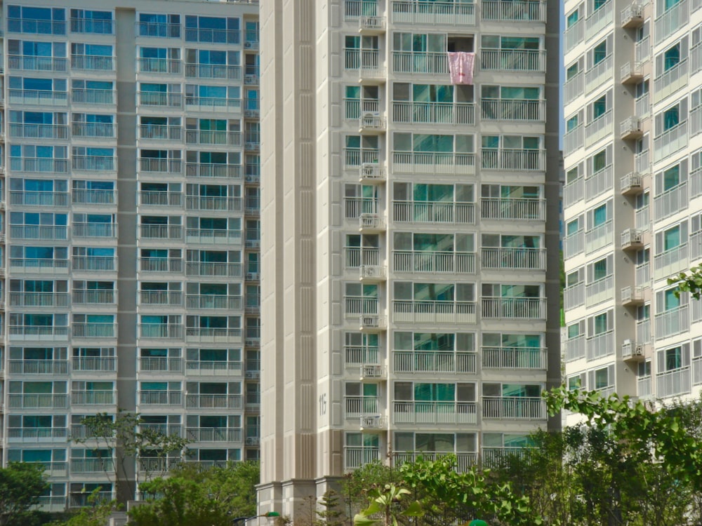 a couple of tall buildings sitting next to each other