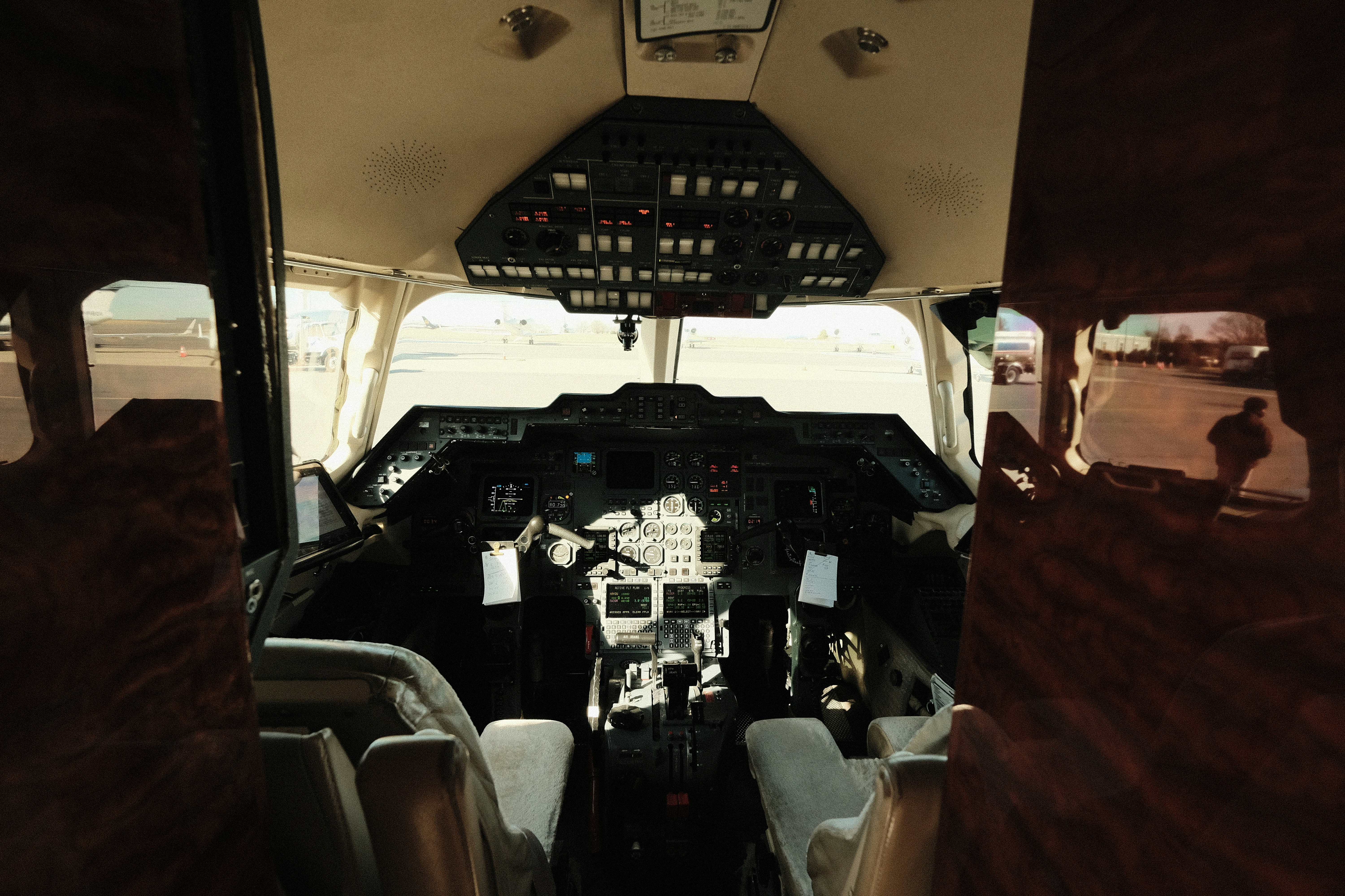 a view of the cockpit of an airplane from the inside, 