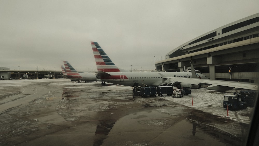 a couple of airplanes that are on a runway