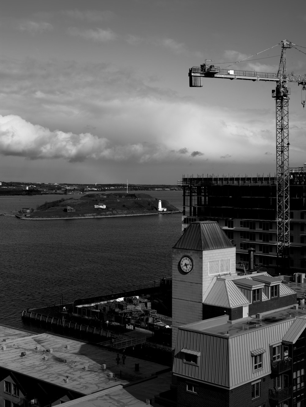 a black and white photo of a building under construction