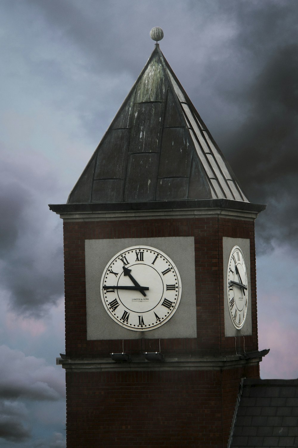 a large clock tower with a sky background