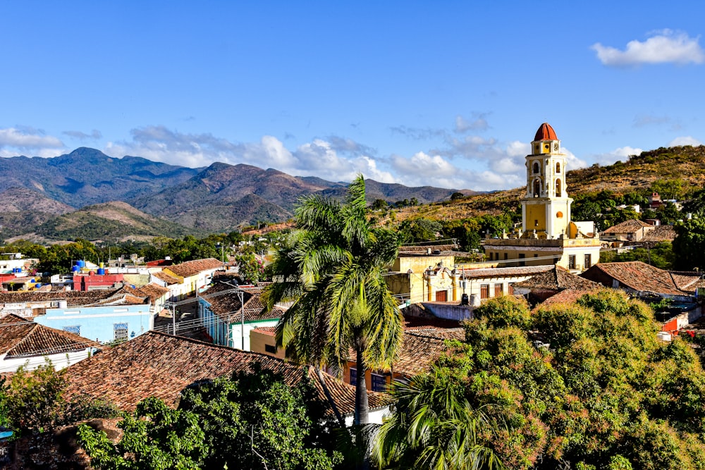 a view of a town with mountains in the background