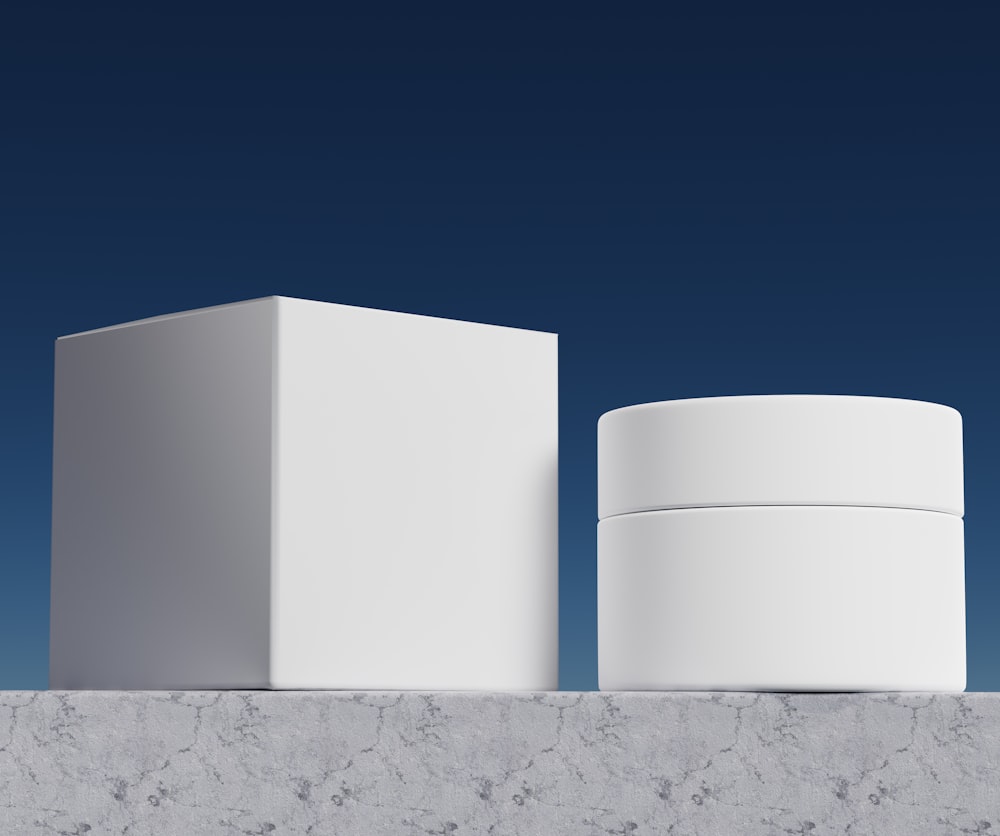 a couple of white boxes sitting on top of a wall