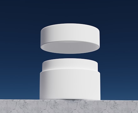 Finished product displayed on a minimalist white pedestal with subtle blue lighting.