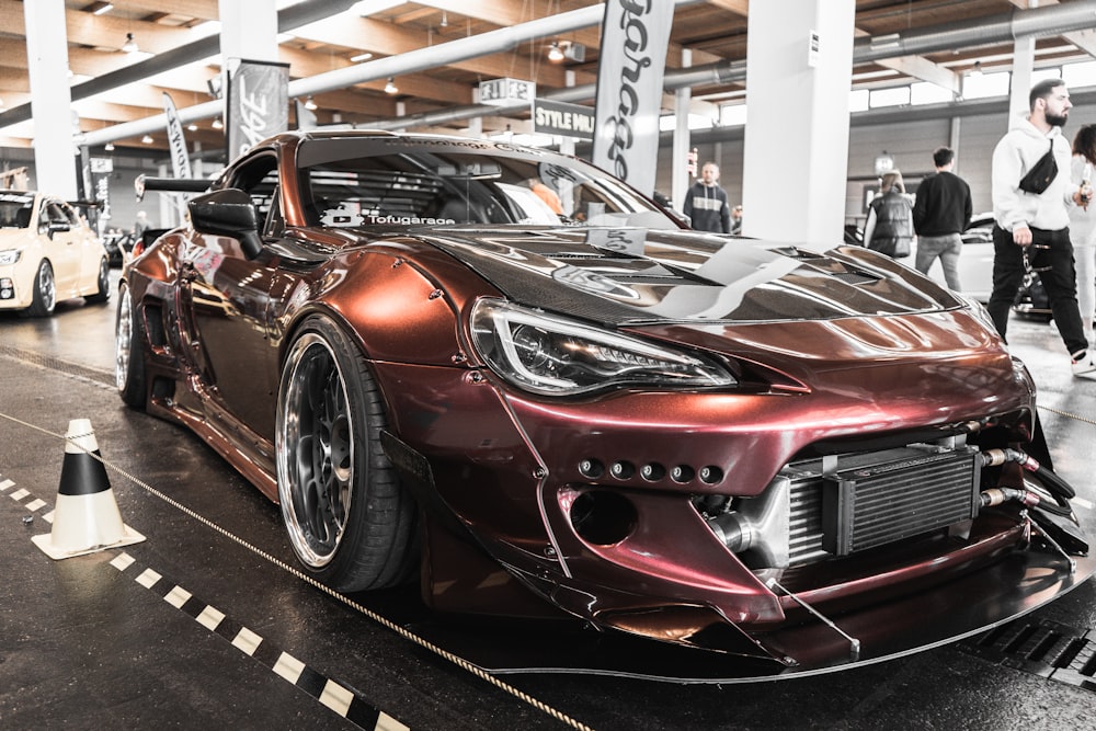 a red sports car parked in a garage