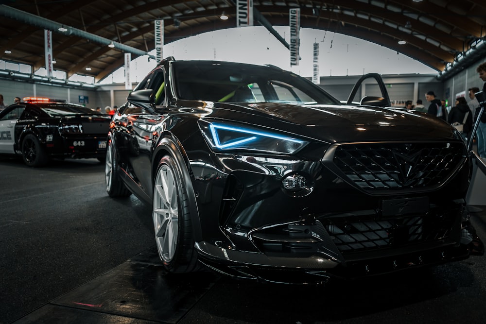 a black car is parked in a garage