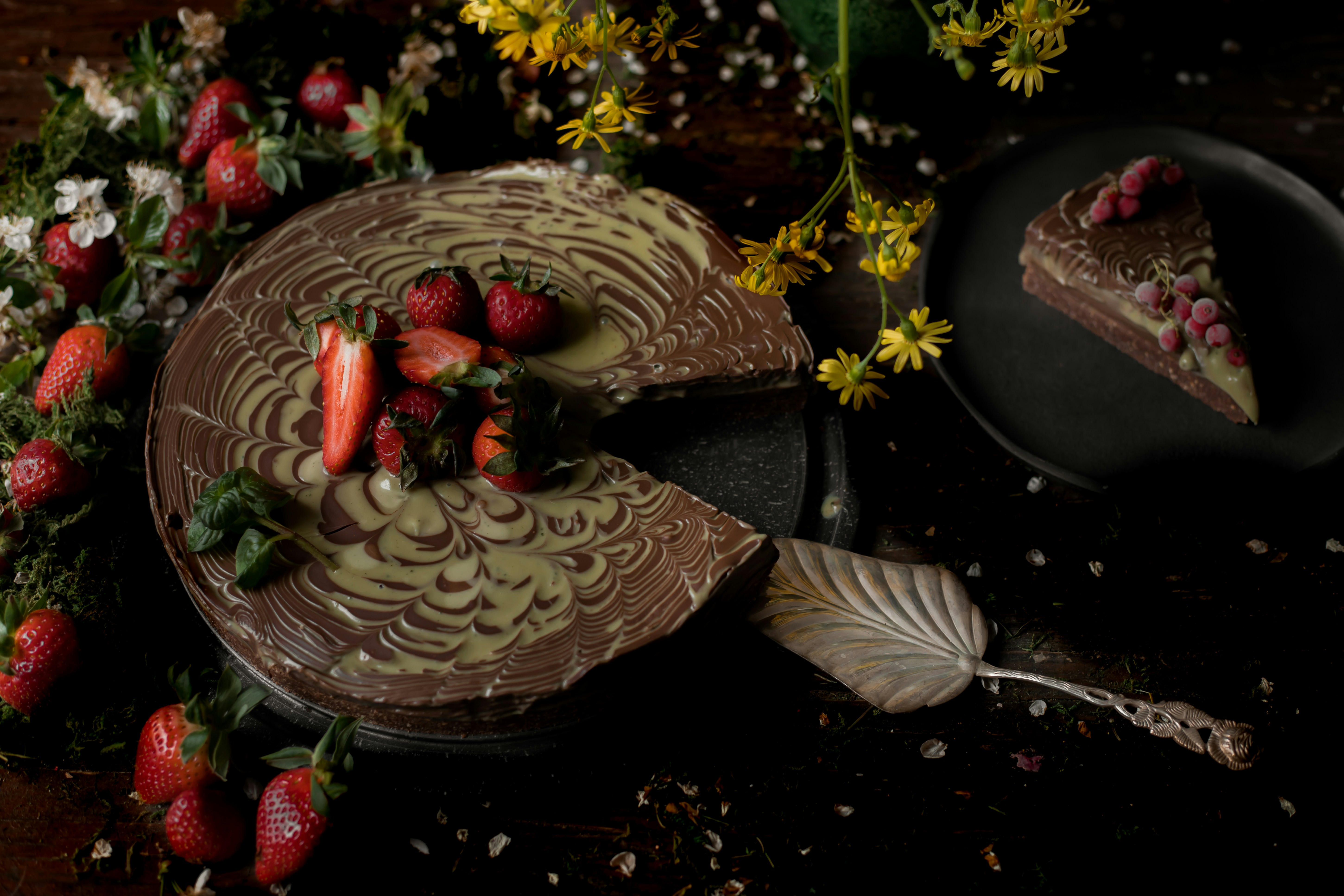 a piece of chocolate cake with strawberries on top