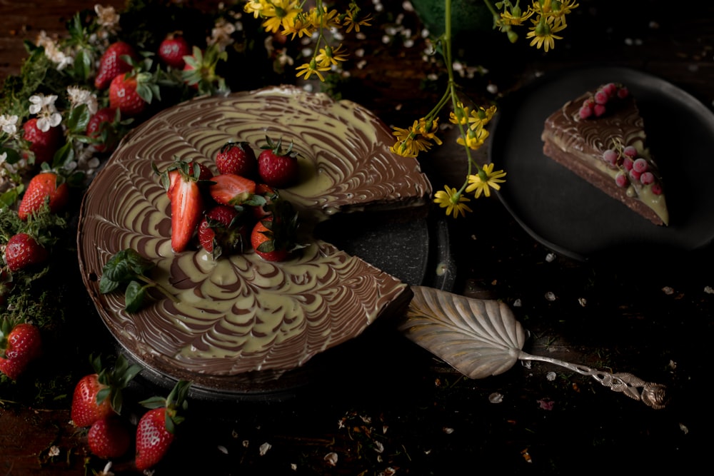 a piece of chocolate cake with strawberries on top