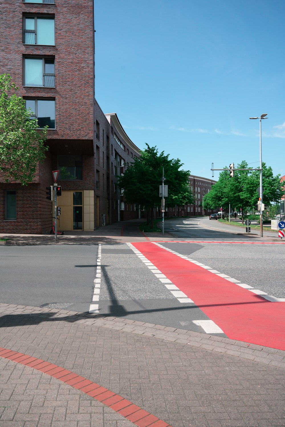 a crosswalk on a city street with a building in the background