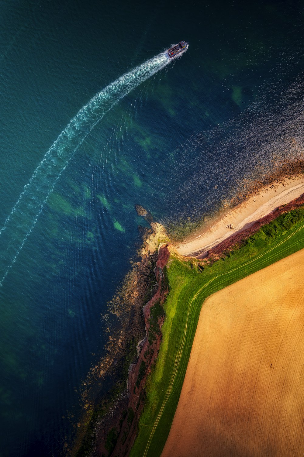 an aerial view of a boat in the water