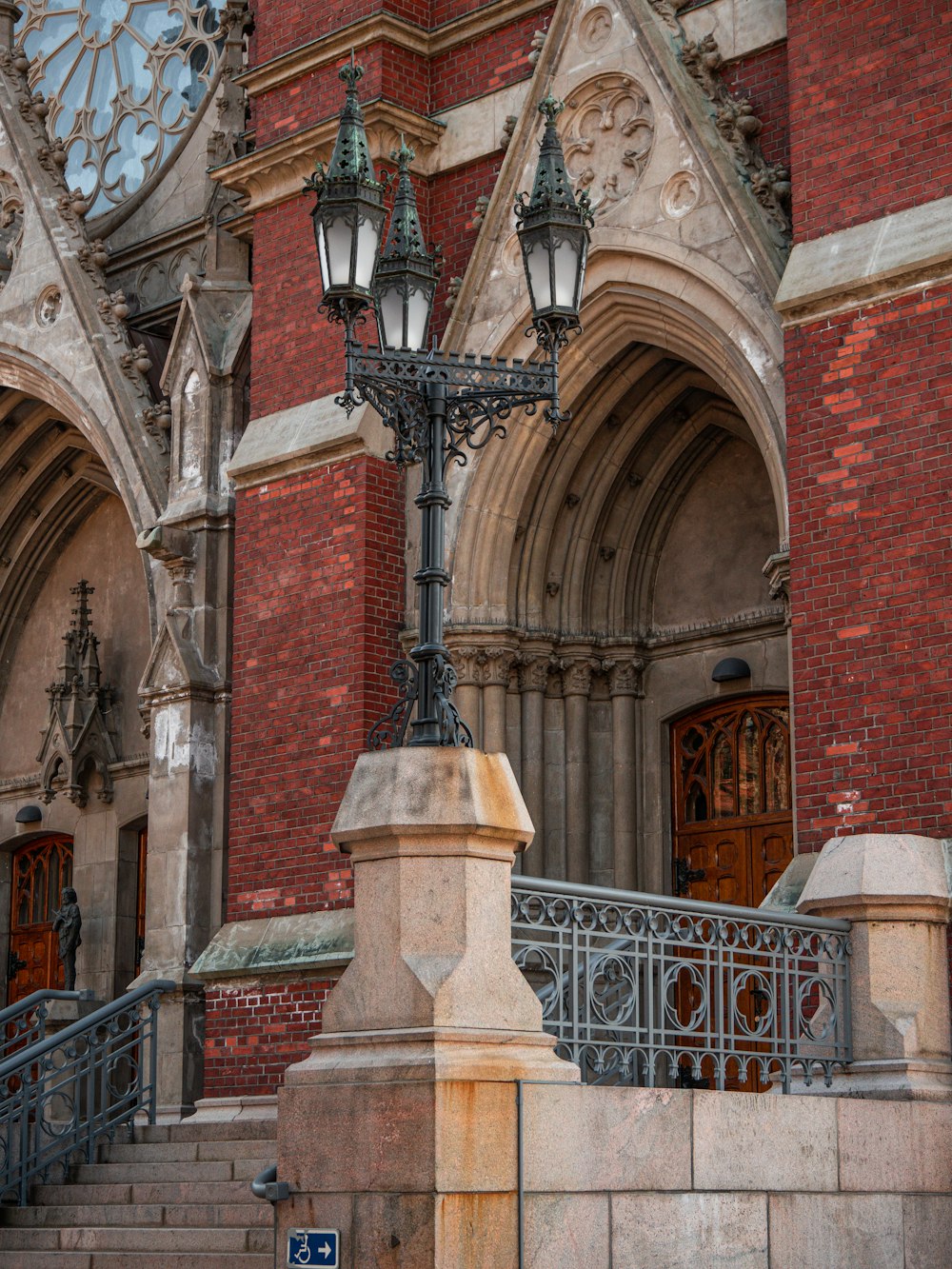 a lamp post in front of a building with a clock on it