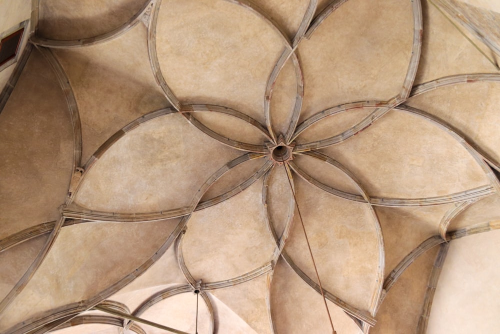 a ceiling with a circular design on it