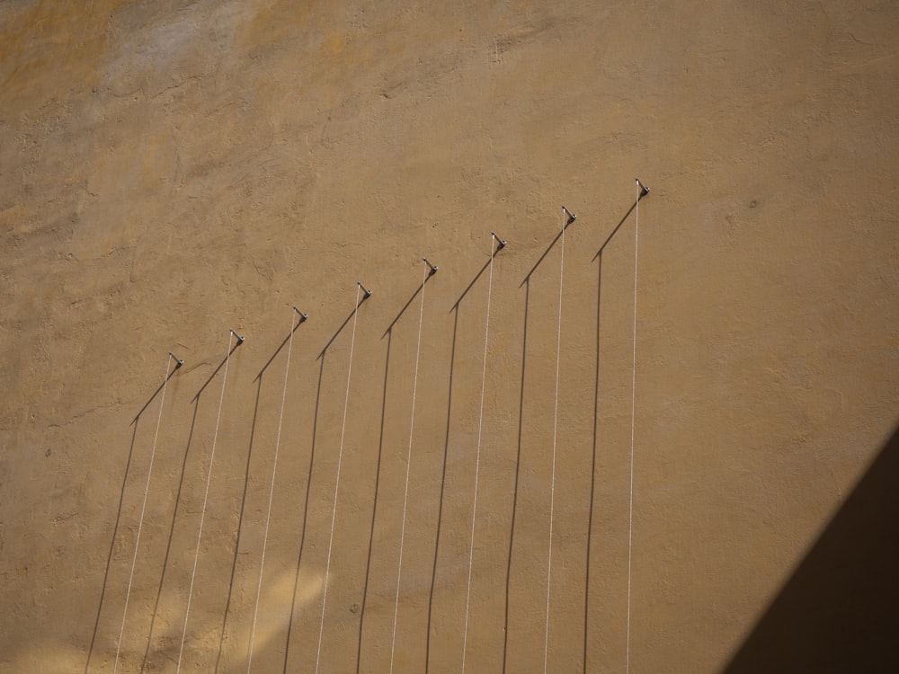 a row of poles on the side of a building
