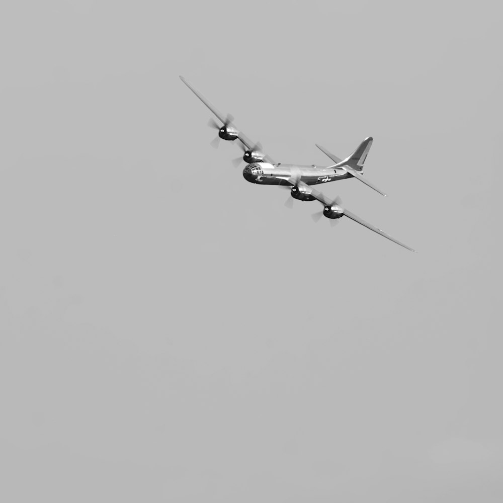 two airplanes flying in the sky on a cloudy day