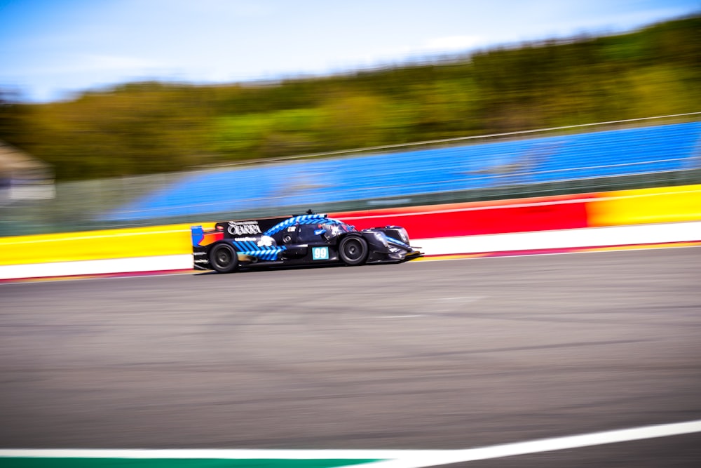 a racing car driving down a race track