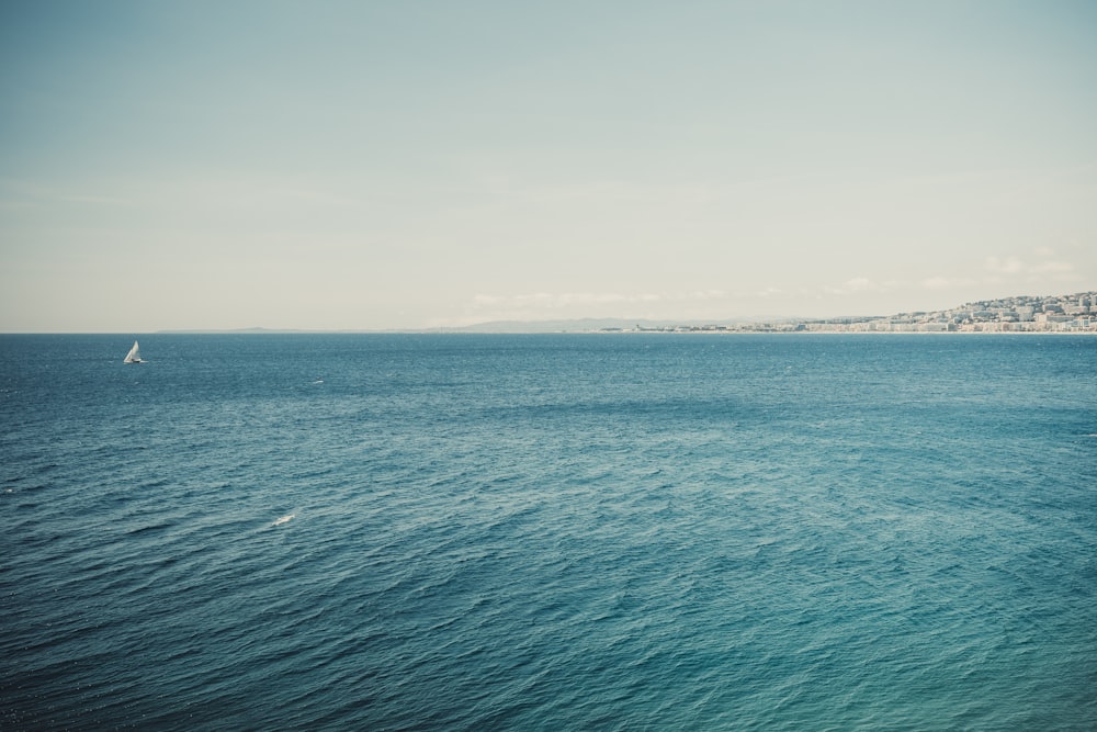 a sailboat in the middle of a large body of water