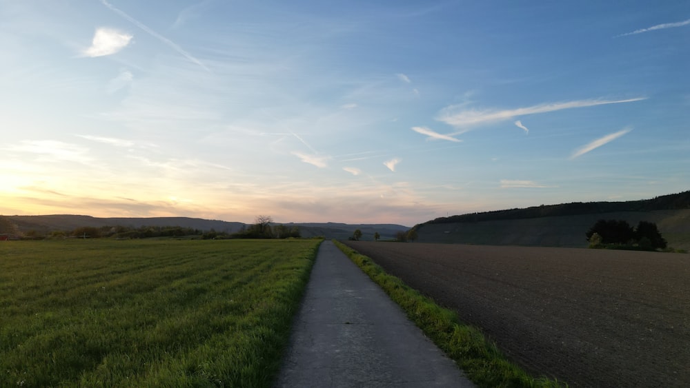 a road that is next to a field