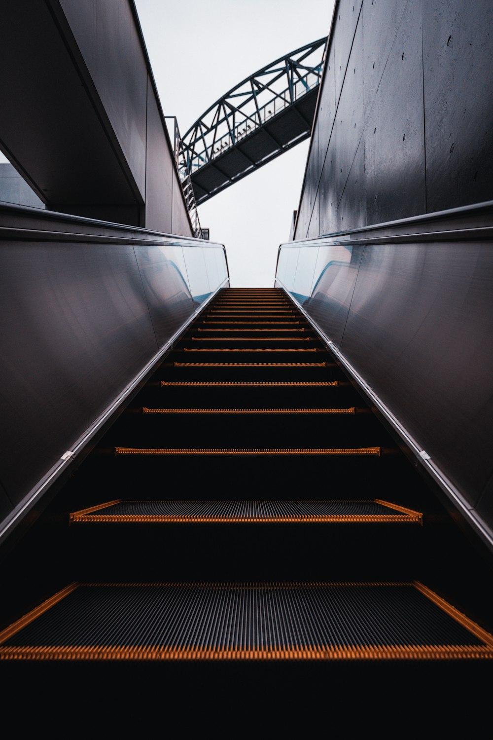 a set of stairs leading up to a bridge