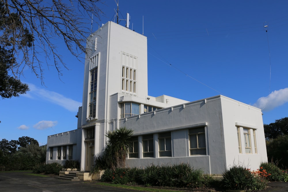 a large white building with a clock tower